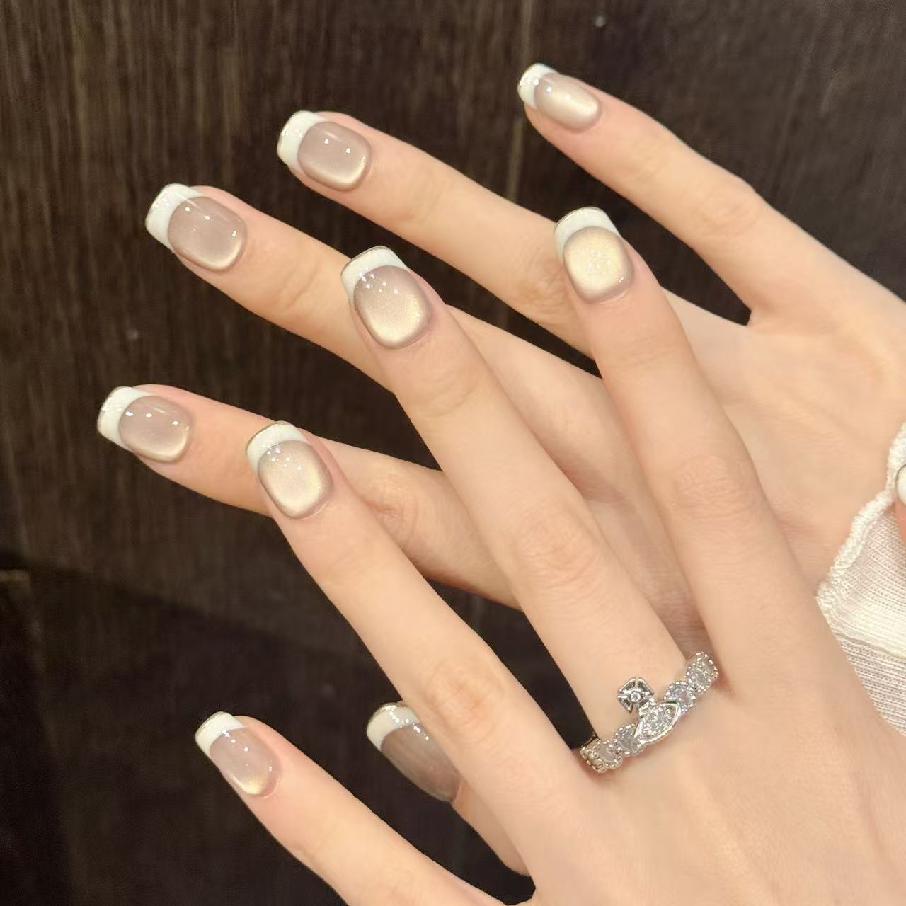 Skin-flattering nude glass-bead cat eye, white-edge French short press-on nails